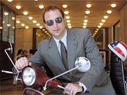Ken Kurson on a bike scooter NY Times
